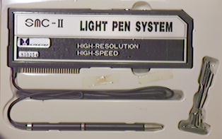 Image: The card and light pen in the box.